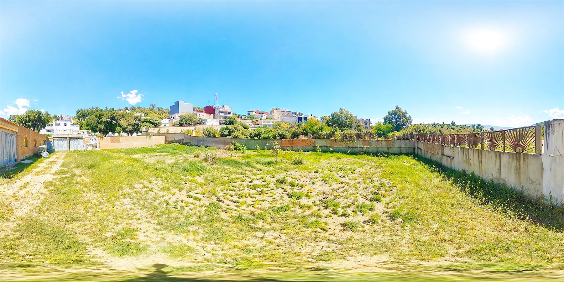 Open land and neighborhood context around Dar Salam Land.